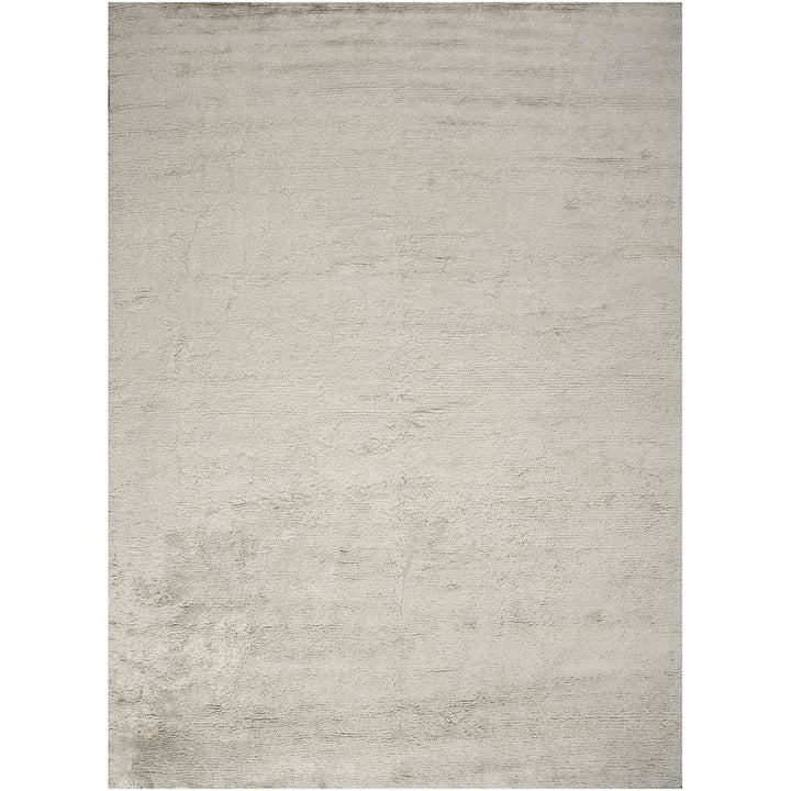 Abstract textured surface in neutral tones with subtle irregularities.