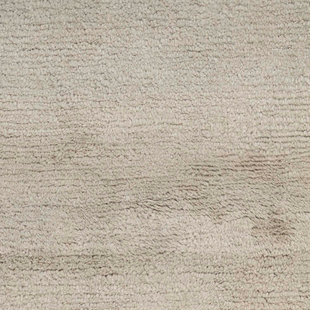Close-up of nubby, neutral fabric with soft, fluffy texture.