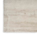 Smooth off-white rug with slight shading variations and neat edges.