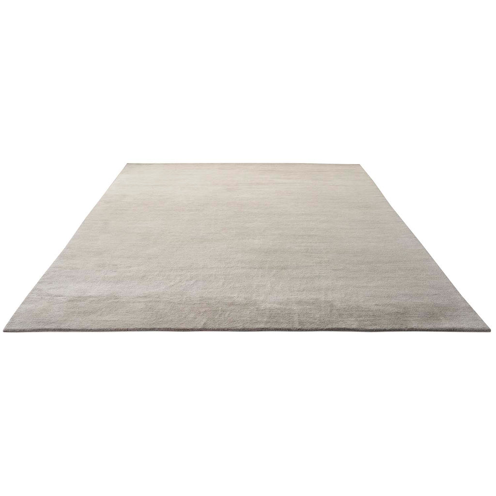 Plain light gray rectangular rug with clean edges on white background.