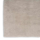 Solid light gray carpet with plush shaggy texture, minimalist design.