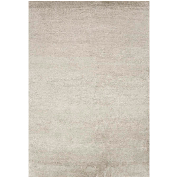 Minimalist cream rug adds texture and warmth to any space.