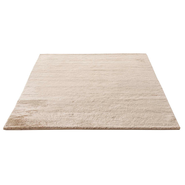 Plain rug with gradient, soft texture; versatile for any decor.