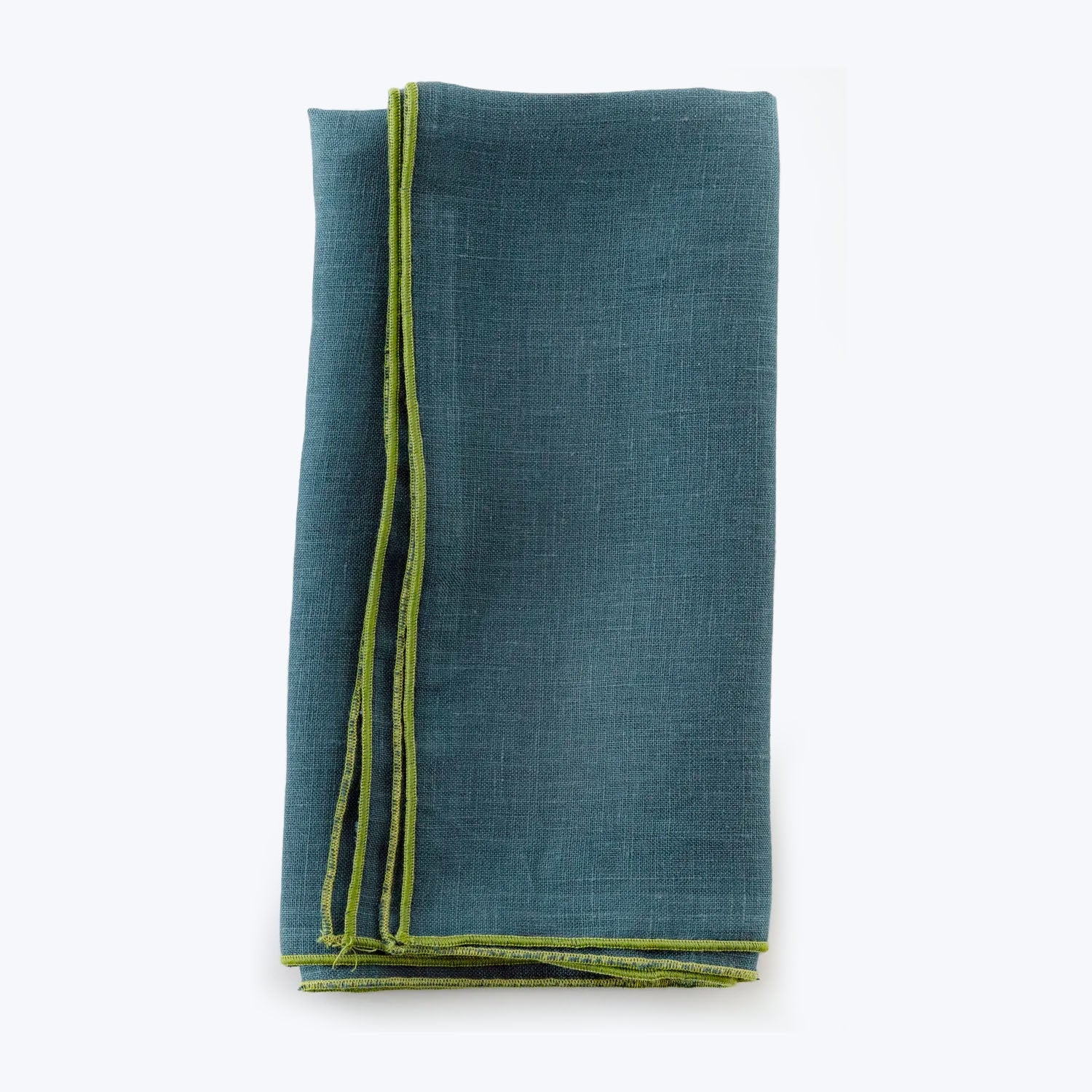 Neatly folded deep blue fabric with greenish-yellow border on white background.