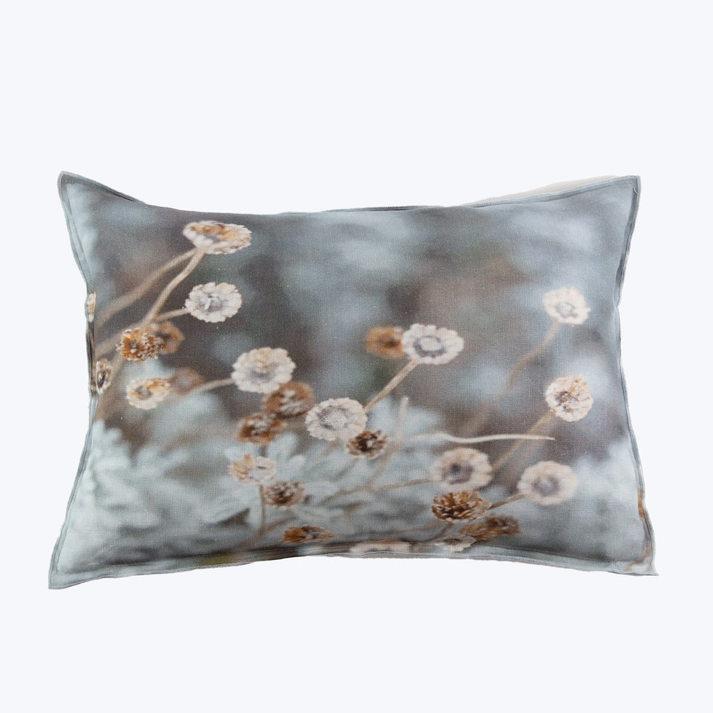 Vintage-style floral print pillow with dried flowers and plants design.