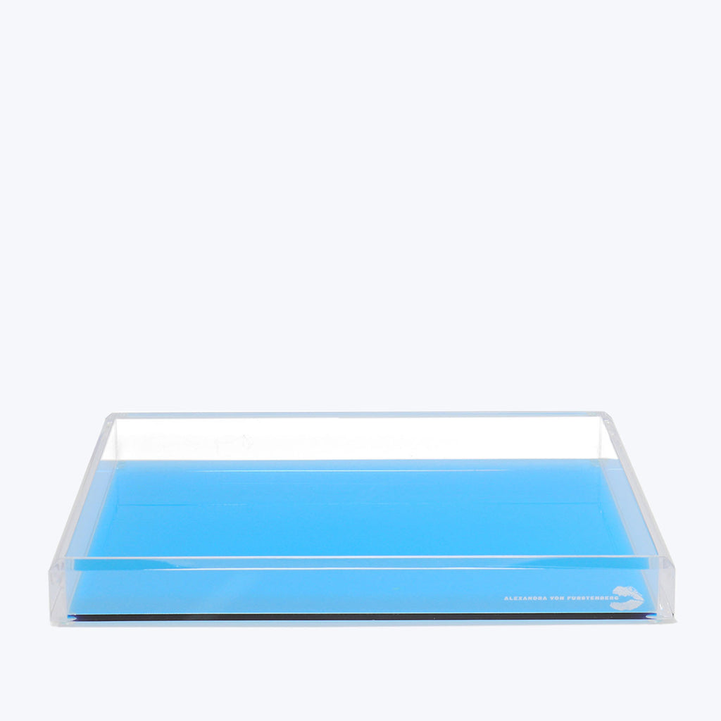 Minimalist transparent tray with blue base, versatile for various purposes.