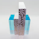 Sleek and modern designer perfume bottle with artistic label design.