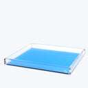 Rectangular acrylic tray with a solid blue base and patterned edge.