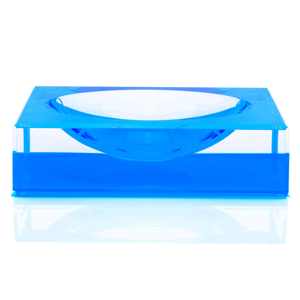 Stylish blue acrylic table with recessed bowl by Alexandra von Furstenberg