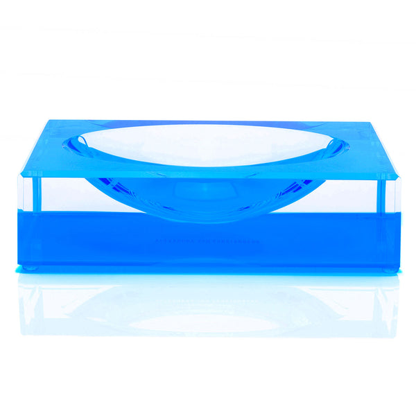 Stylish blue acrylic table with recessed bowl by Alexandra von Furstenberg