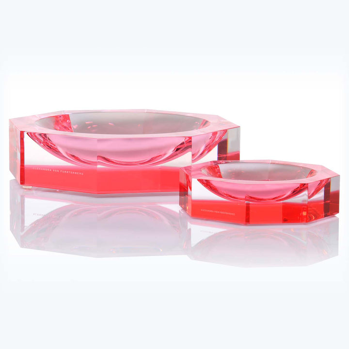Elegant, modern red decorative objects with a sleek, glossy finish.