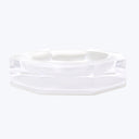 Clear glass ashtray with geometric design adds modern style.