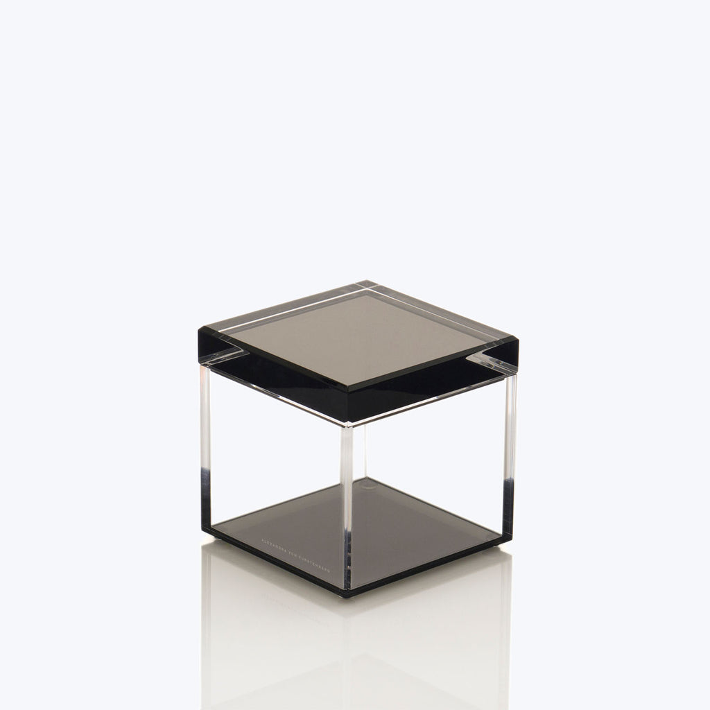 Contemporary minimalist table with mirrored glass top and sleek design