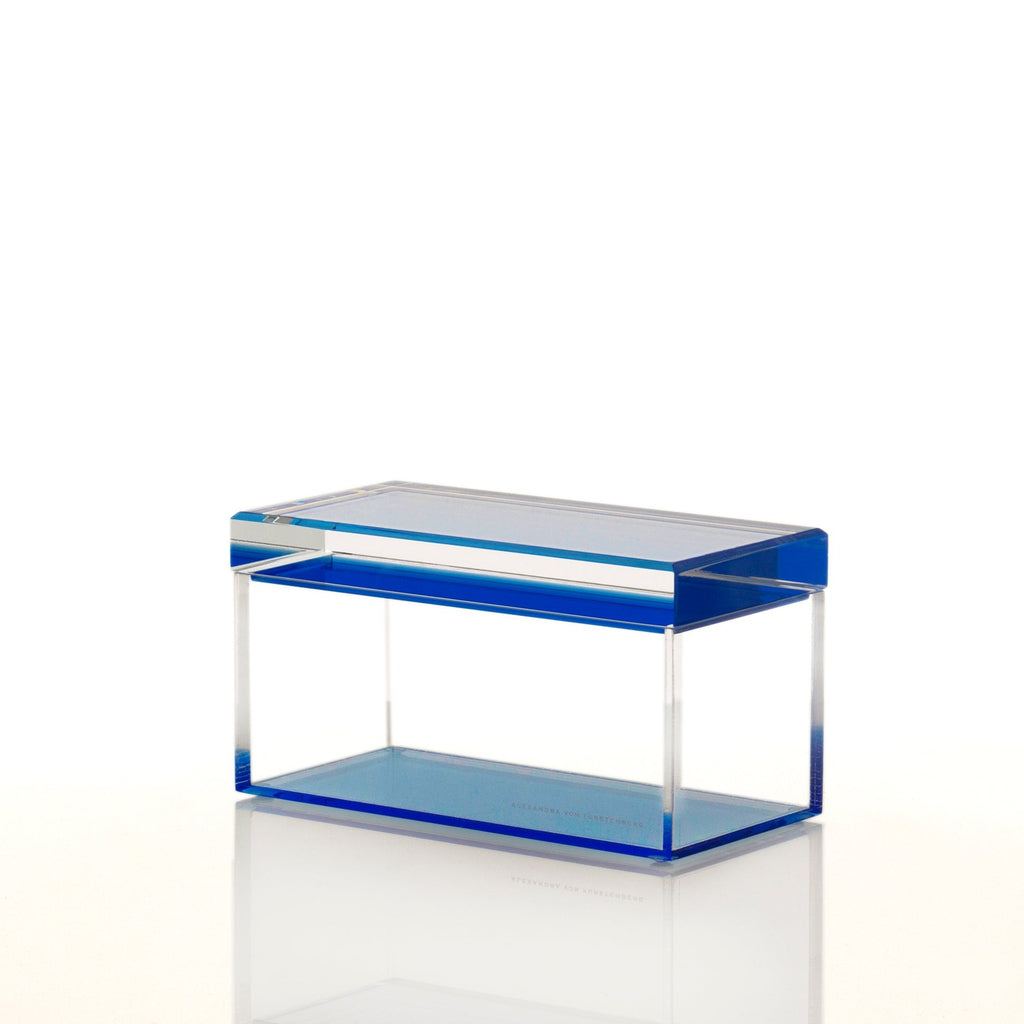 Minimalistic acrylic box with transparent walls and bold blue accents.