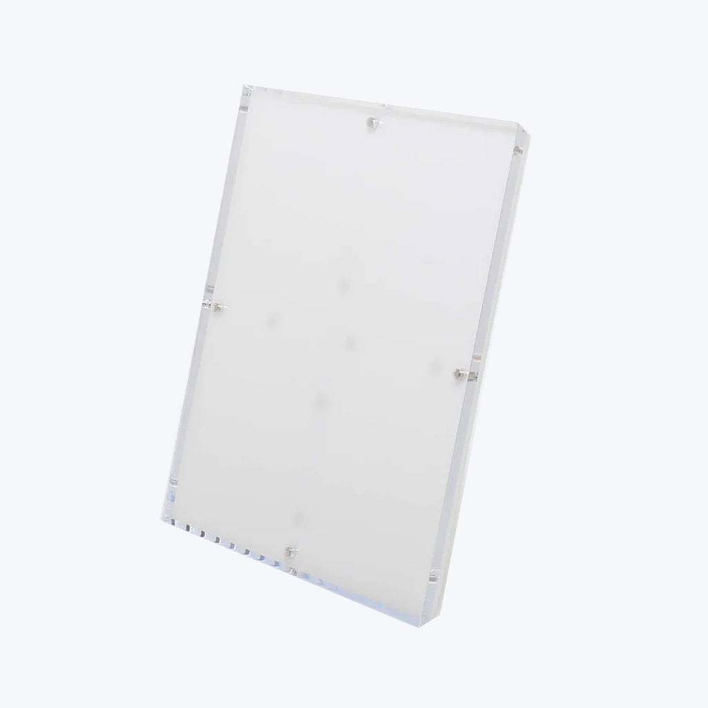 Clear acrylic panel with drilled holes, positioned at an angle.