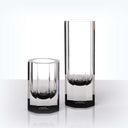 Minimalist designer glass objects with elegant opaque embellished bases.