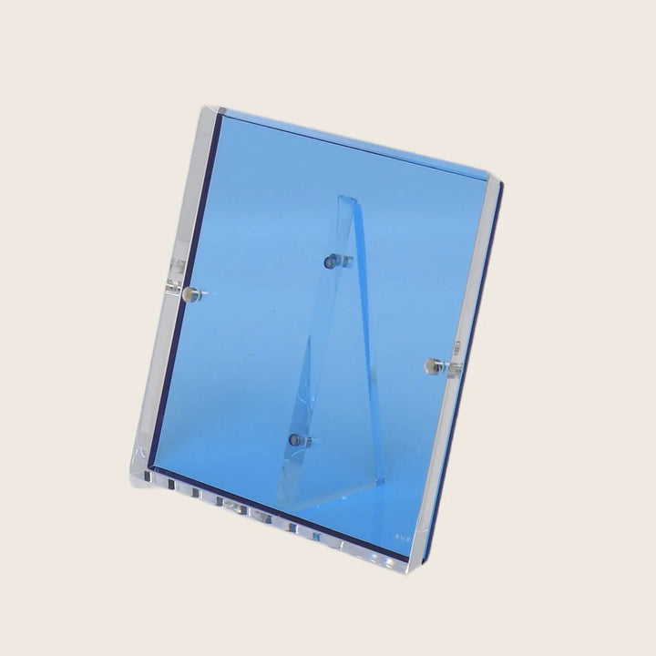 Transparent blue acrylic display stand showcasing a menu or sign.