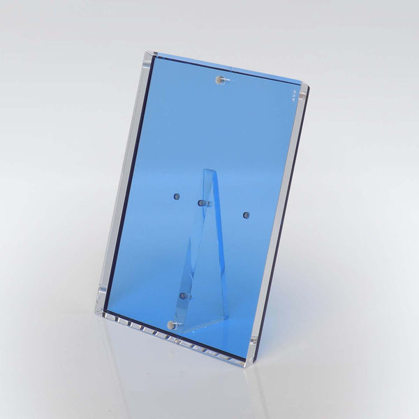 Blue-tinted acrylic holder for signs or paper with sleek design.