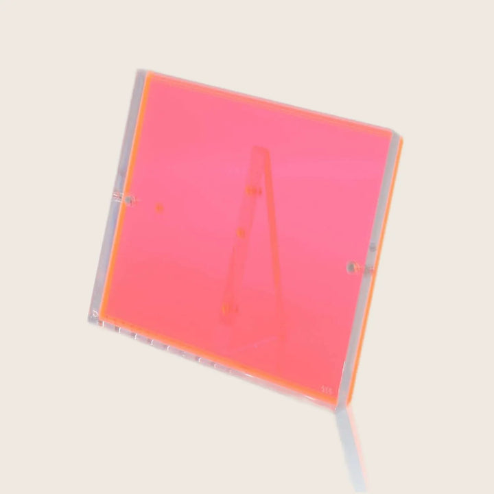 New translucent red acrylic display stand with smooth glossy surface.