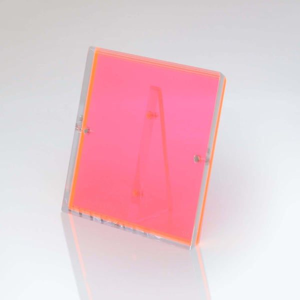 Neon pink acrylic display stand with translucent nodes and hinges.