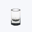 Modern glass vase with ribbed design, featuring sleek, elegant style.