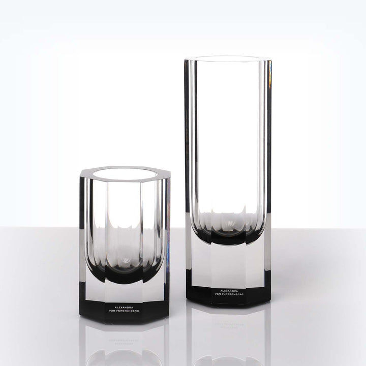 Two sleek glass vases by Alexandra von Furstenberg on display.