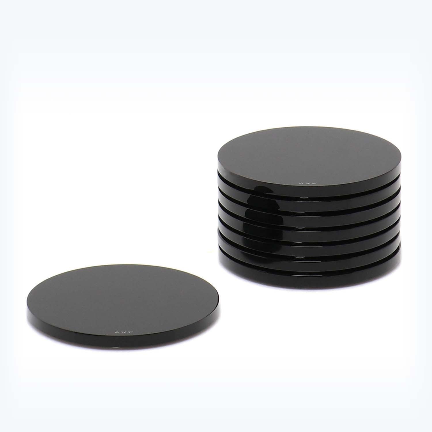 Two disk-shaped objects, one flat and one stacked, against white background.