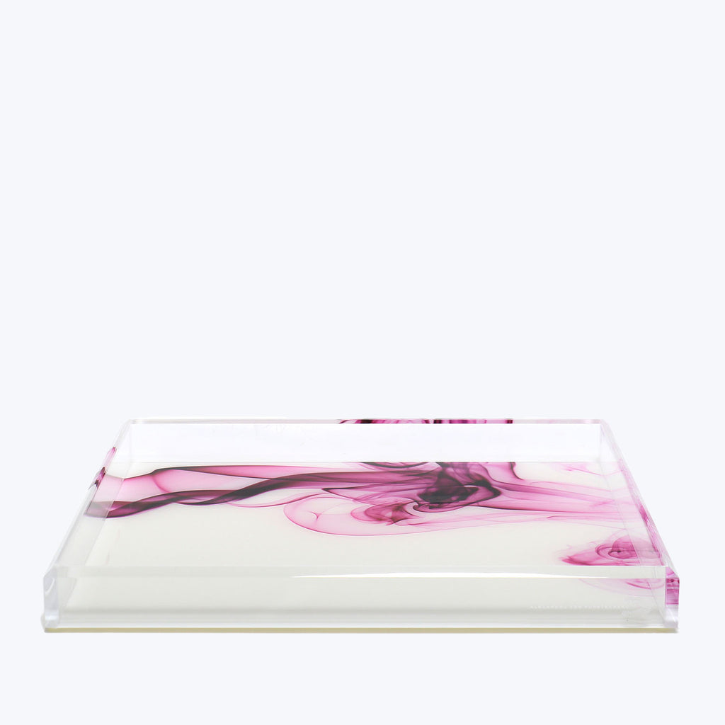An abstract pink swirl design on a clear acrylic tray.