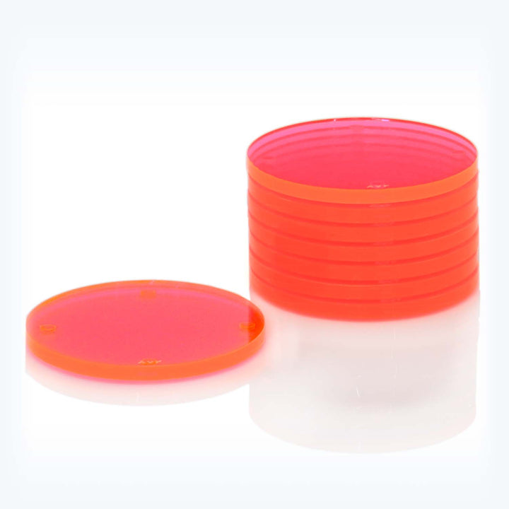 Translucent red plastic container and lid on white background.