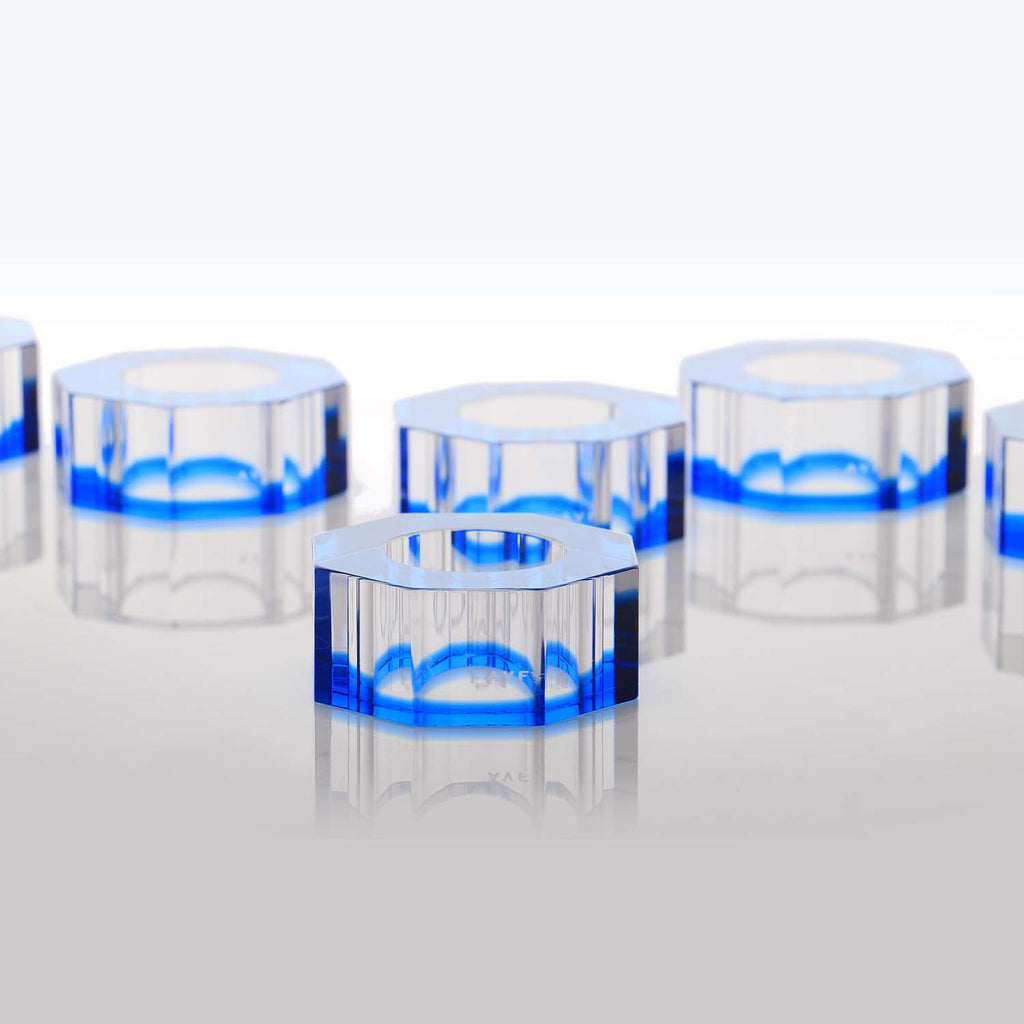 Studio shot of transparent glass or plastic rings with blue tint