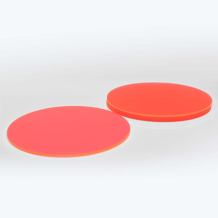 Vibrant red discs with smooth surface and visible edges.