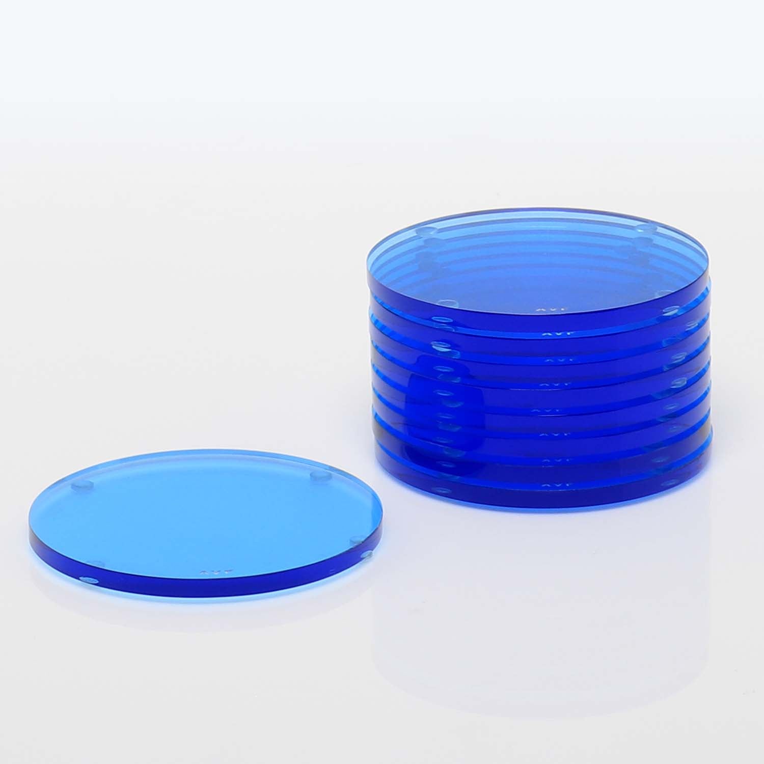 Blue plastic Petri dishes and lid on a clean white surface.