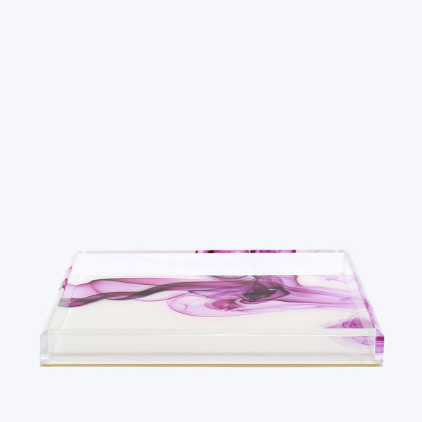 Rectangular transparent object with elegant purple swirling ink design.