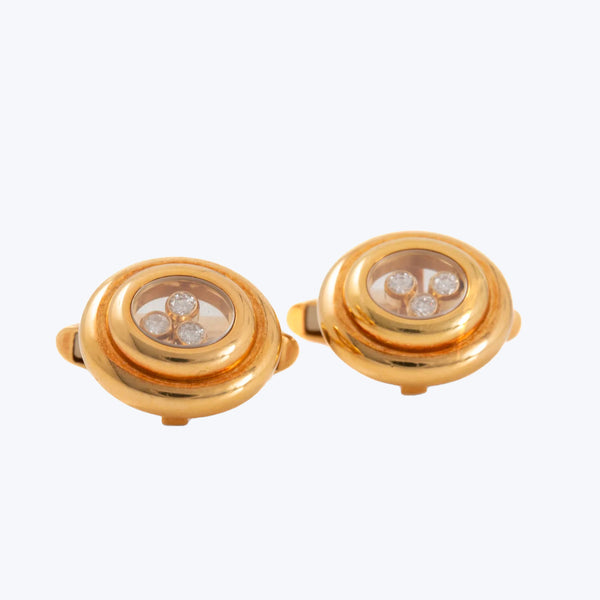Elegant gold-tone cufflinks with concentric circles and small clear stones