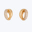Classic and elegant gold hoop earrings with diamond-like stone embellishments.