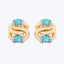 Elegant gold earrings with twisted design, turquoise stones, and diamonds.