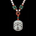 Exquisite Asian-inspired necklace adorned with a intricate white jade pendant.