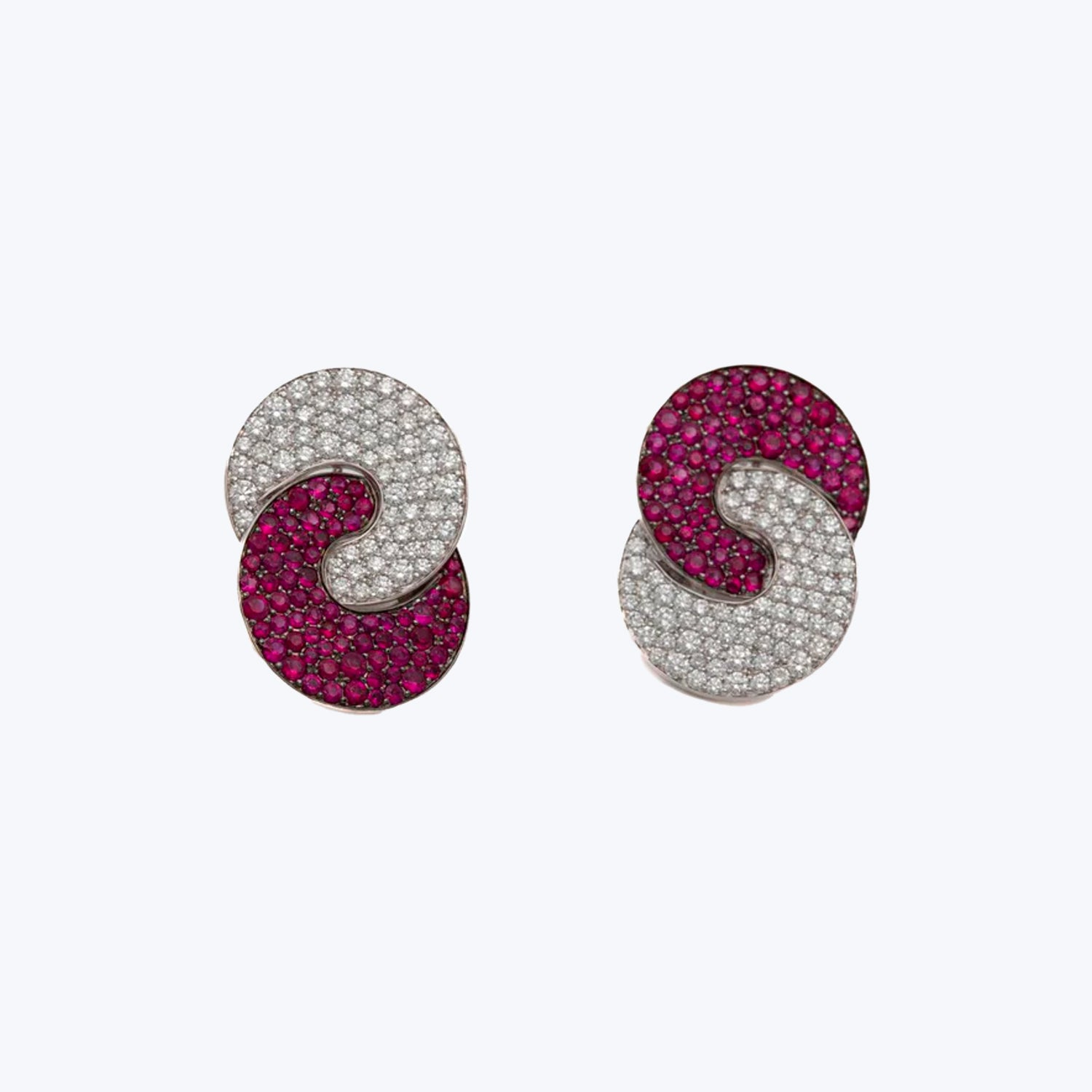Stunning spiral earrings with pink and clear gemstone embellishments.