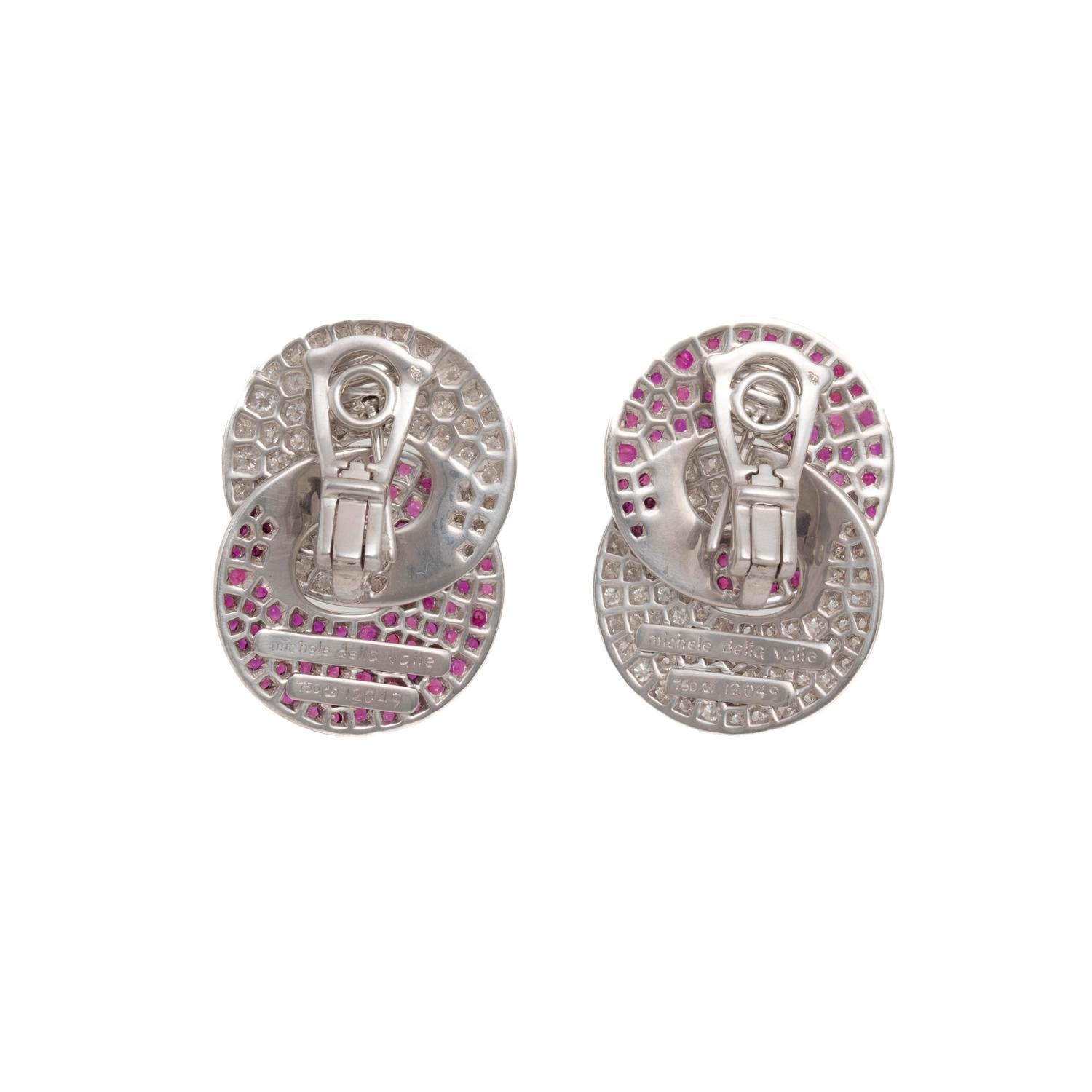 Elegant oval clip-on earrings with silver-tone base and pink crystals.