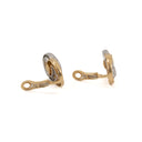 Exquisite gold cuff links feature gemstone center & diamond halo