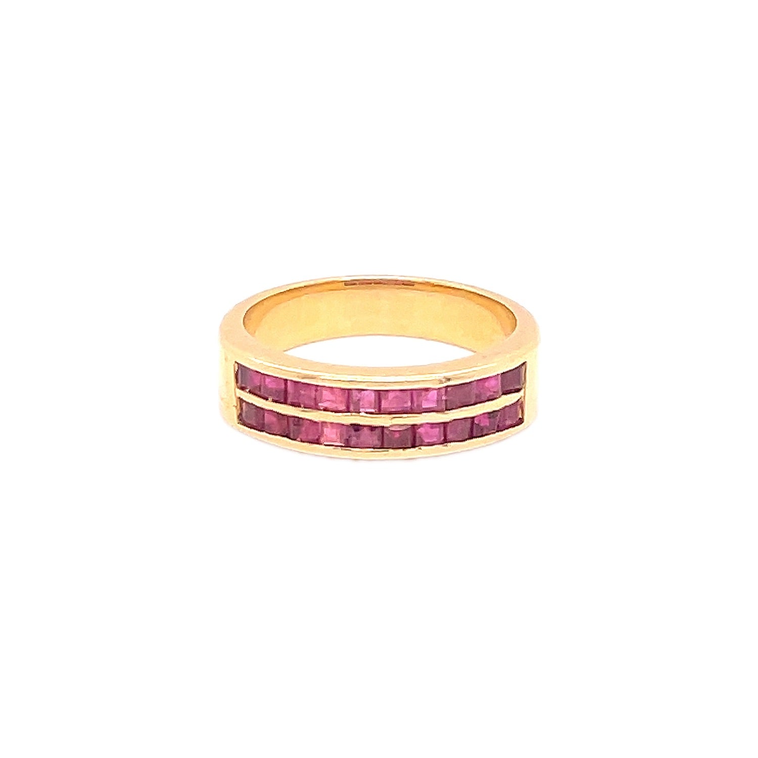 Gold ring with channel-set pink stones for an elegant touch.