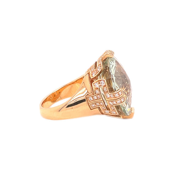 Exquisite rose gold ring with pear-shaped, champagne diamond centerpiece.