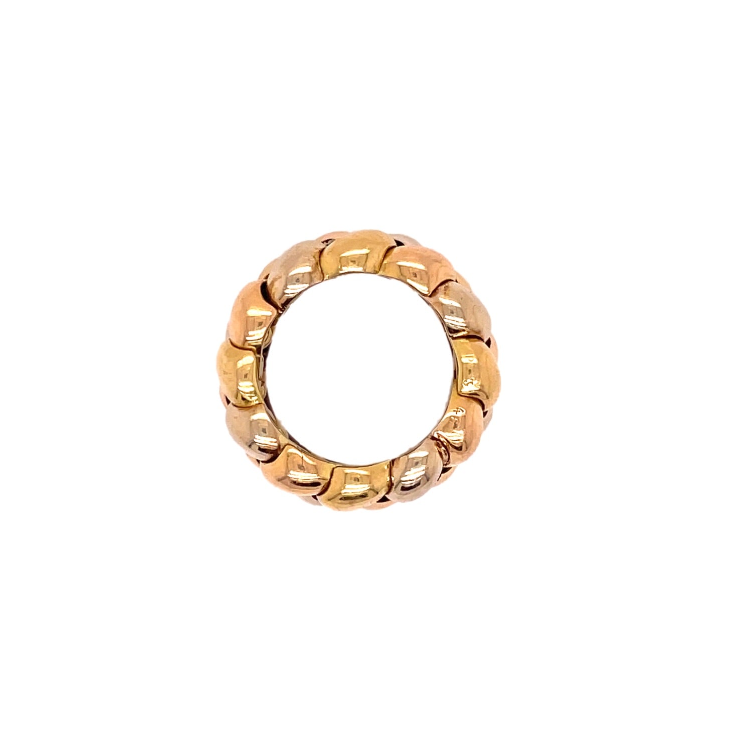 Close-up photograph of a gold ring featuring uniform shaped segments.
