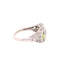 Exquisite vintage-style silver ring with a pale green gemstone centerpiece.