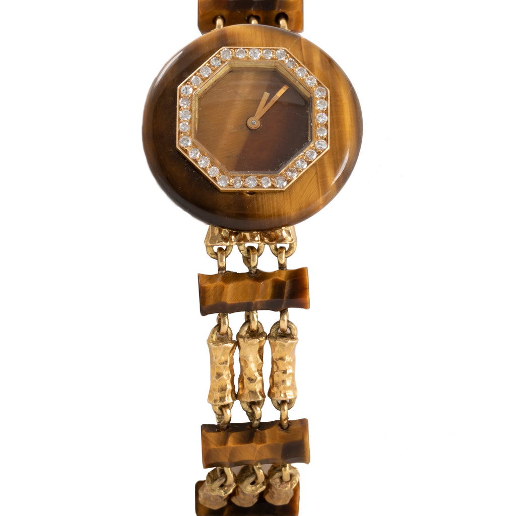 Stylish wristwatch with unique octagonal bezel, crystal accents, and brown dial.