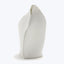 Abstract white sculpture with organic curves resembling folded fabric peak.