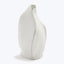 Modern white ceramic vase with asymmetrical form and sculptural design.