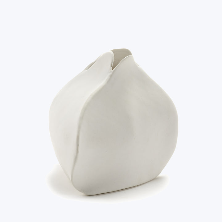 Sculptural neutral object with smooth surface and abstract, organic form.