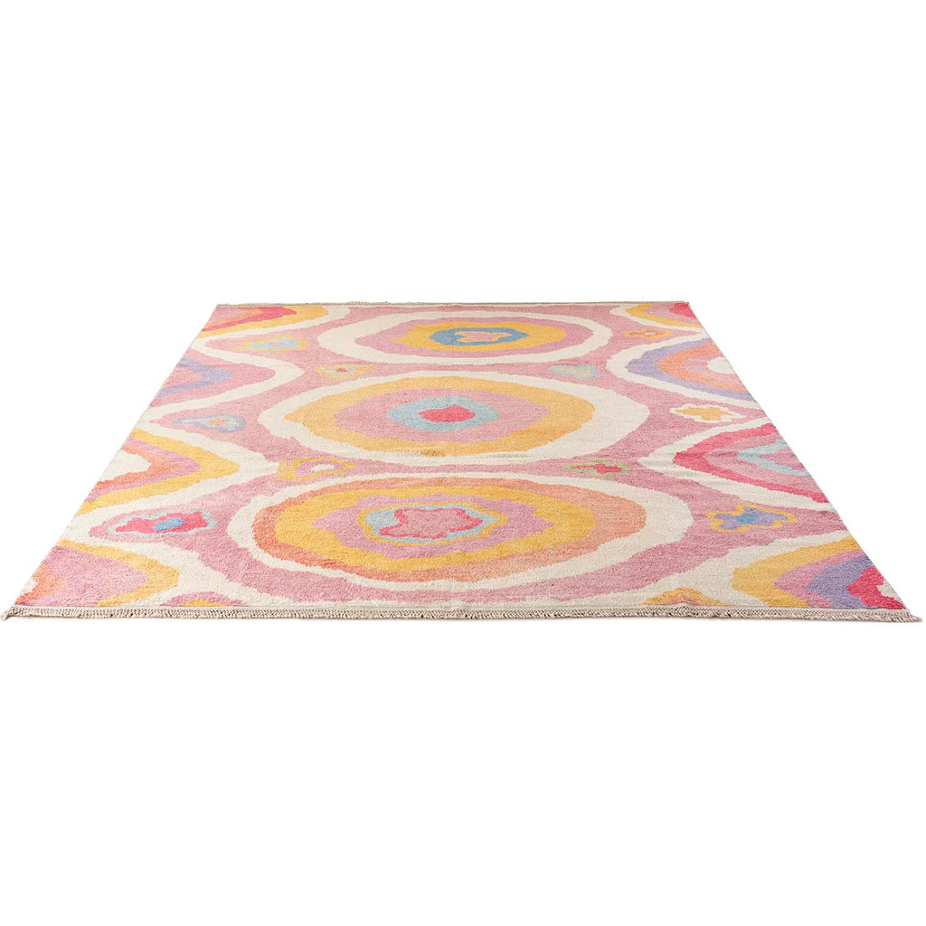 Vibrant, abstract rug with concentric circles and ovals in multiple colors.