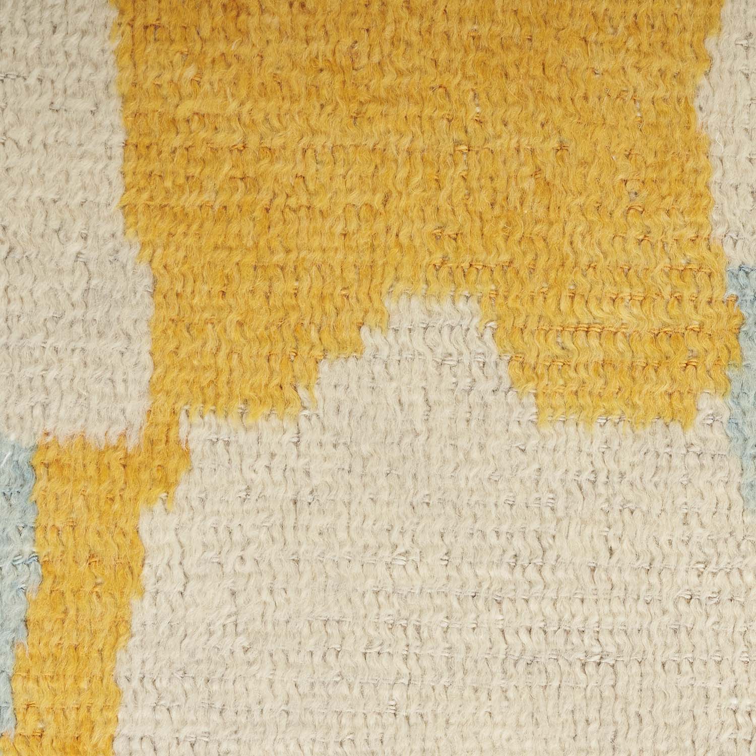 Close-up of textured fabric with vertical stripes in warm colors.